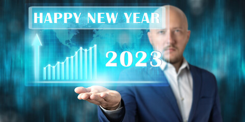 Concept of increase business in 2023 year, businessman holding virtual screen with graphs, happy new year