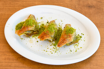 Turkish Dessert Sobiyet  Baklava, mussels baklava and classic baklava with Pistachio . Cevizli, Fistikli Baklava, top view.