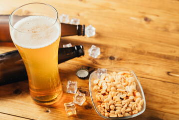 Beer with nuts and chips. Beer in a bottle