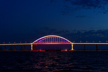 Fototapeta premium Seascape with a view of the illumination of the Crimean Bridge
