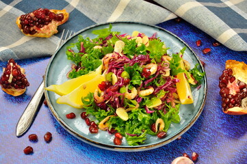 Delicious fresh salad with prawns and pomegranate.
