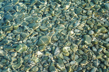 Coast of the Croatian sea. Clear water with pebbles