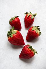 Fresh strawberries on a gray background. Top view.