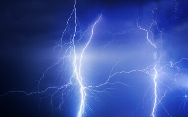 Fork lightning striking down during summer storm	