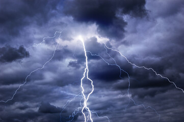 Fork lightning striking down during summer storm © Solid photos