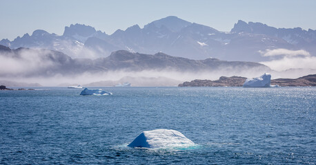 Panoramic landacpe of icebergs and mountains in Prince Christian Sound, South Greenland