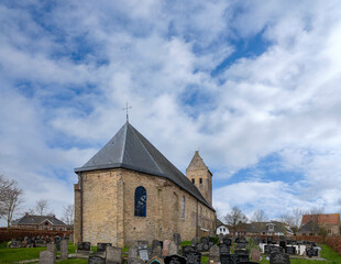 Fototapeta na wymiar Historrical Saint Laurentius Church (11th century) in Kimswerd, Friesland