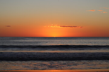 Fototapeta na wymiar Small Waves Nicaragua Sunset