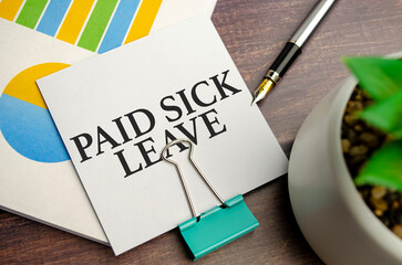 Paid sick leave words on notepad and charts