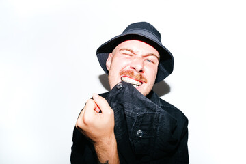 Portrait of androgynous model On Isolate Background Biting His Jacket