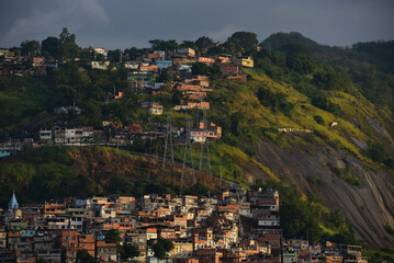 Sunset on precariously located favelas of the Zona Norte, or North Zone, of Rio de Janeiro, Brazil - obrazy, fototapety, plakaty