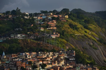 Fotobehang Sunset on precariously located favelas of the Zona Norte, or North Zone, of Rio de Janeiro, Brazil © Pedro