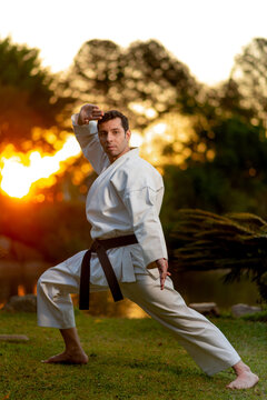 Karate black belt man performing kata outdoors