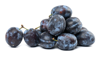 Stack of ripe blue plums on white isolated background