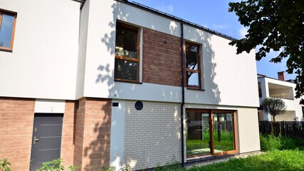 Terraced family home in newly developed housing estate. The real estate market in the suburbs.