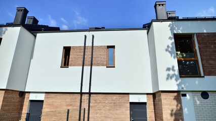 Terraced family home in newly developed housing estate. The real estate market in the suburbs.