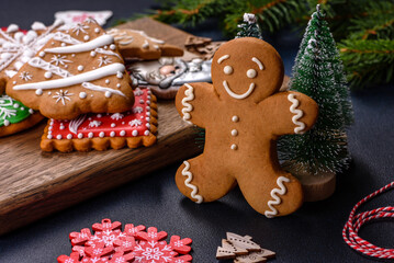 Christmas homemade gingerbread cookies on a dark concrete table table