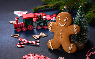 Christmas homemade gingerbread cookies on a dark concrete table table