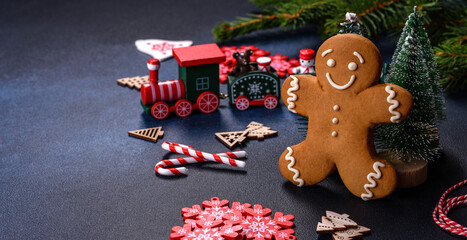 Christmas homemade gingerbread cookies on a dark concrete table table