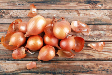 Onions on wooden background