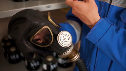 Checking gas masks. Clip. Testing of new gas masks in the workflow at factories