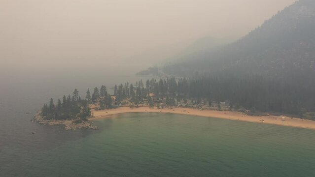 Lake Tahoe - Sand Harbor Covered in Thick Smoke from Wildfires - Aerial 4k - 2021