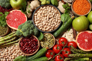 Fresh vegetables, fruits and seeds on table, flat lay