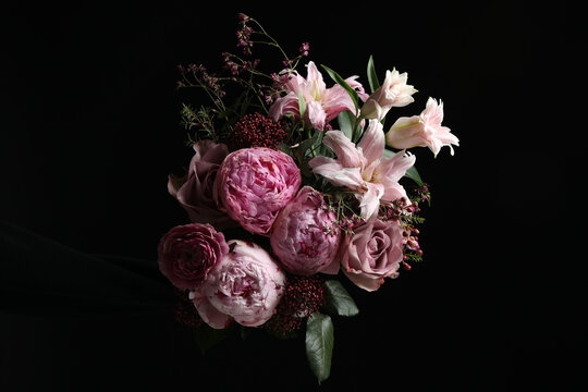 Beautiful bouquet of different flowers on dark background