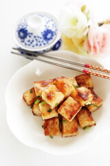 Chinese food, radish cake and XO sauce stir fried with spring onion 