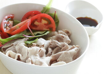 Japanese summer food, boiled pork slices served with baby leaves and cherry tomato