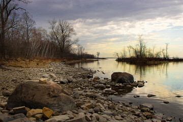 Cap-Saint-Jacques Montreal landscape rocky shoreline with river water reflections