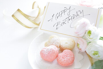 French confectionery, heart shaped Macaroon and hand written Happy Birthday message card