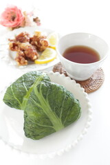 Japanese food, green leaf wrapped rice ball with sesame seed 