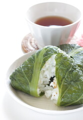 Japanese food, green leaf wrapped rice ball with sesame seed 