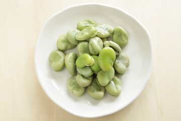 Boiled Japanese broad bean on plate for healthy snack food image