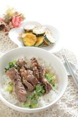 Korean barbecue steak and spring onion on rice for gourmet lunch