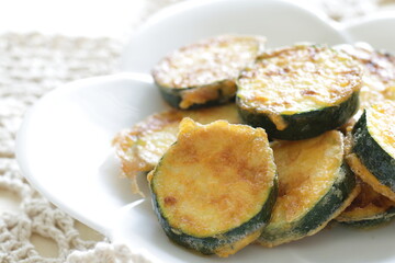Korean food, deep fried zucchini Jeon on dish for comfort food