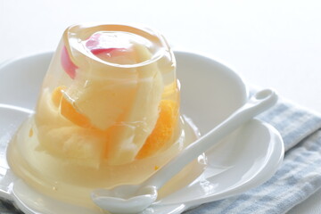 Mixed fruit Jelly on white dish with spoon for dessert image