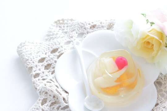Mixed fruit Jelly on white dish with spoon for dessert image