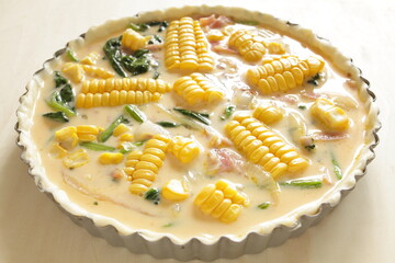 Milk and egg wash with sweet corn and bacon for quiche cooking image 