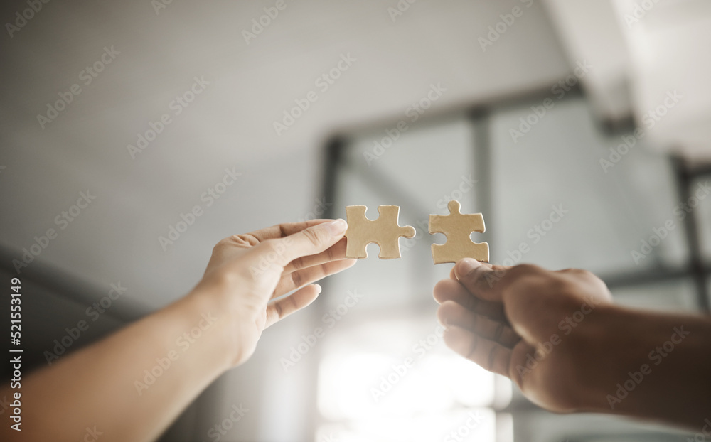 Aufkleber Closeup hands of partners in unity, planning and working on strategy puzzle piece game. People collaborating on innovative jigsaw parts to fit together as part of teamwork planning project.