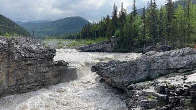 Elbow Falls in the Kananaskis region of the Canadian Rockies near Calgary, Alberta. Heavy water flow after the big rain.