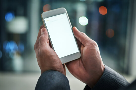 White, Blank Phone Screen And Copyspace Of Male Hands Holding A Mobile. A Man Holds A Smartphone Closeup While Enjoying The Modern Digital Age Of Technology. Scrolling Social Media Online At Night