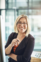 Fototapeta premium Happy, professional and corporate business woman writing creative ideas, taking notes and brainstorming alone in an office at work. Portrait of a smiling employee planning and designing a strategy