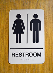restroom aka toilet sign on wooden wall, unisex water closet, comfort travel, healthy environment diversity