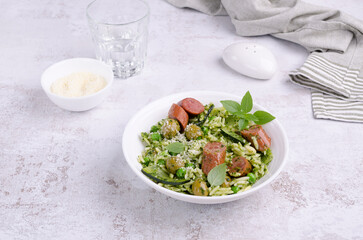 Pasta with vegetables and sausages