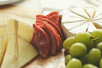 A closeup view of a cheese board.