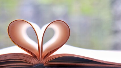 Open book make heart shaped, love symbol, faith, spiritual and worship.