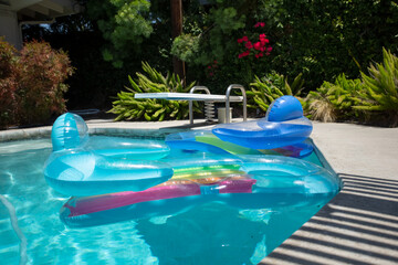 A view of two inflatable swimming pool floaties.