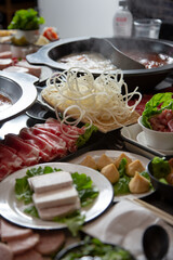 A view of all the elements of a hot pot meal.